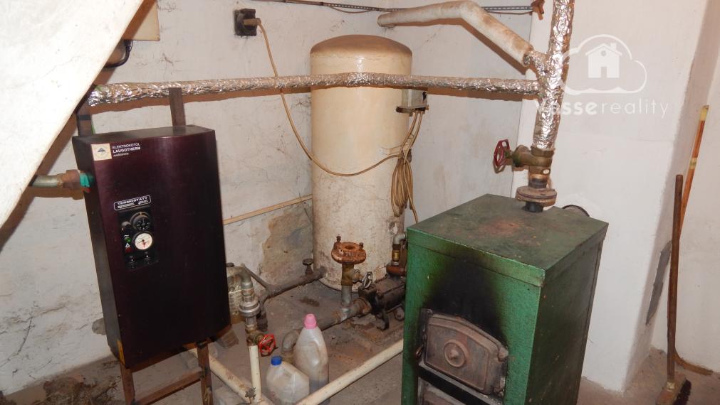 Na predaj 3 izbový dom v Kravanoch nad Dunajom s garážou .